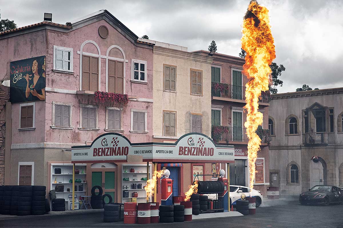 Cinematic installation of Italian gas station with fiery explosion, art exhibition in Mykonos, Greece