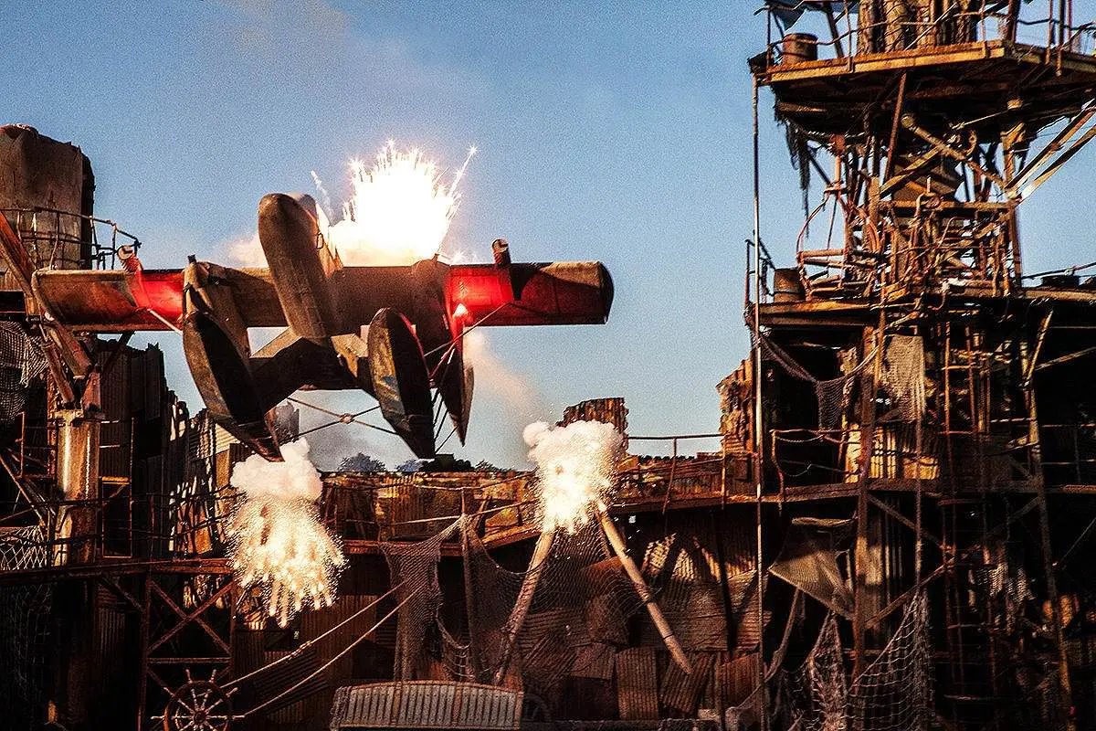Dramatic plane with fire and sparks at industrial set, cinematic art exhibition in Mykonos, Greece