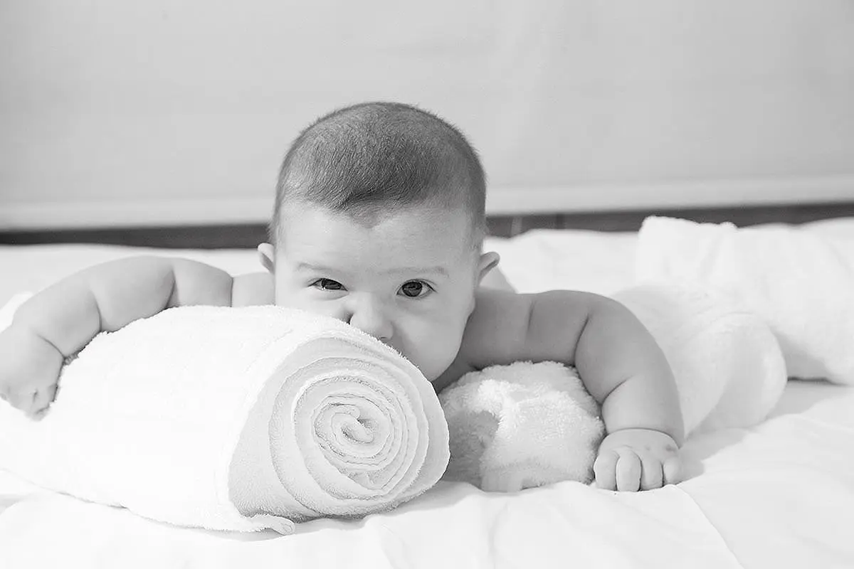 Natural-light infant baptism portrait in Mykonos, Greece