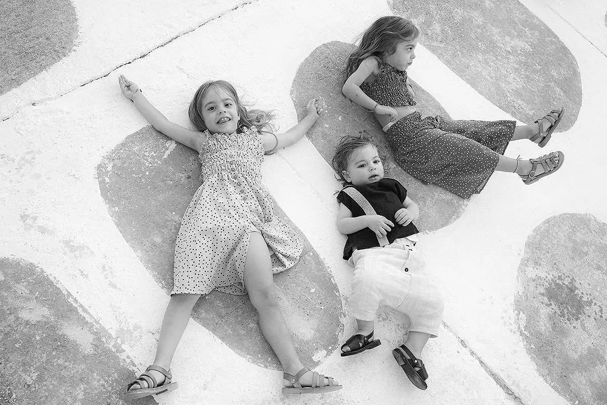 Black and white baptism portrait of children in Mykonos, Greece