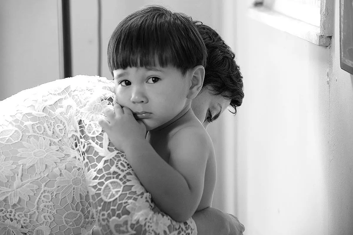 Greyscale candid baptism moment in Mykonos, Greece