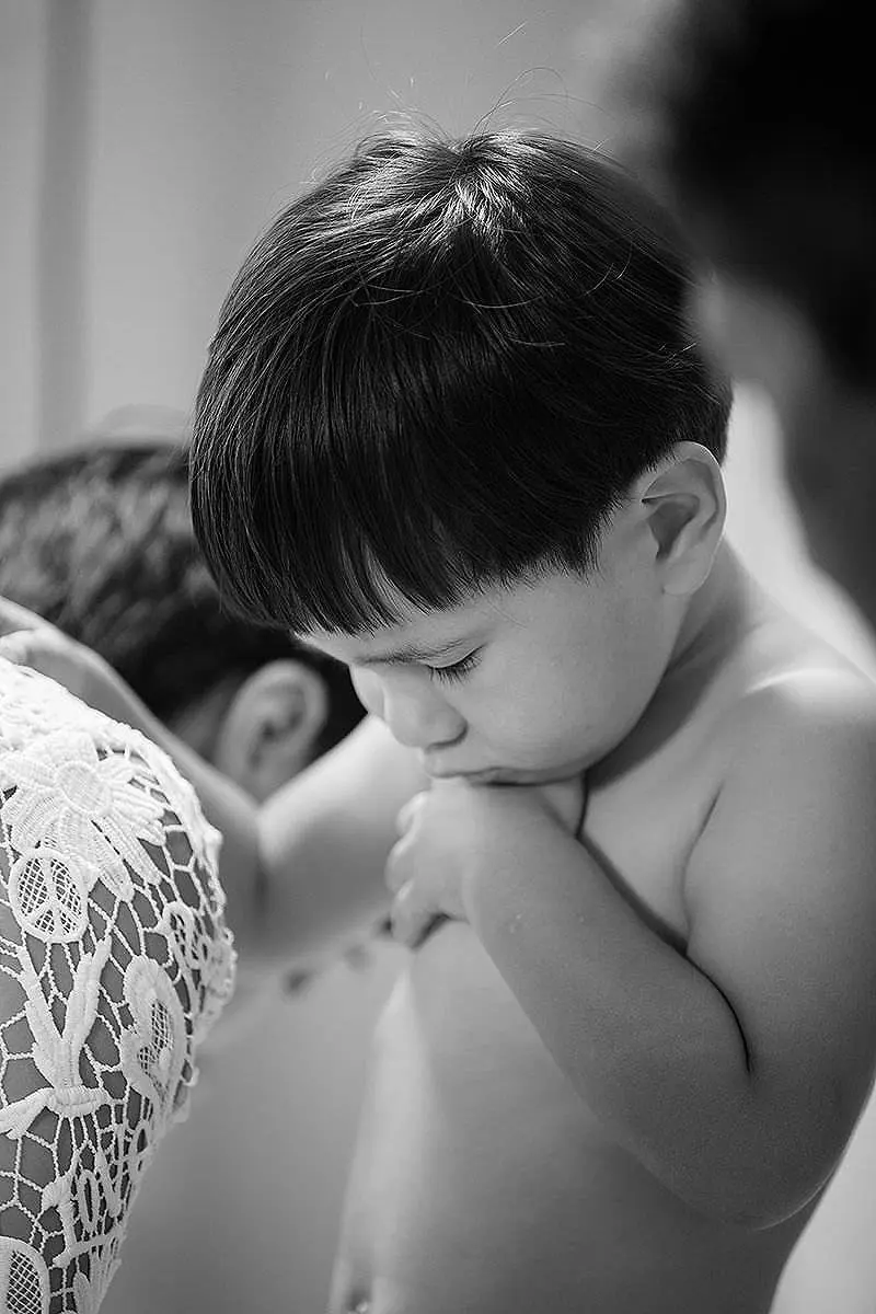 Black and white baptism portrait against white walls in Mykonos, Greece