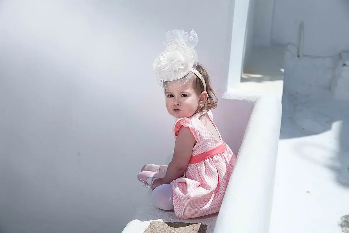 Cycladic white-wall baptism portrait session in Mykonos, Greece