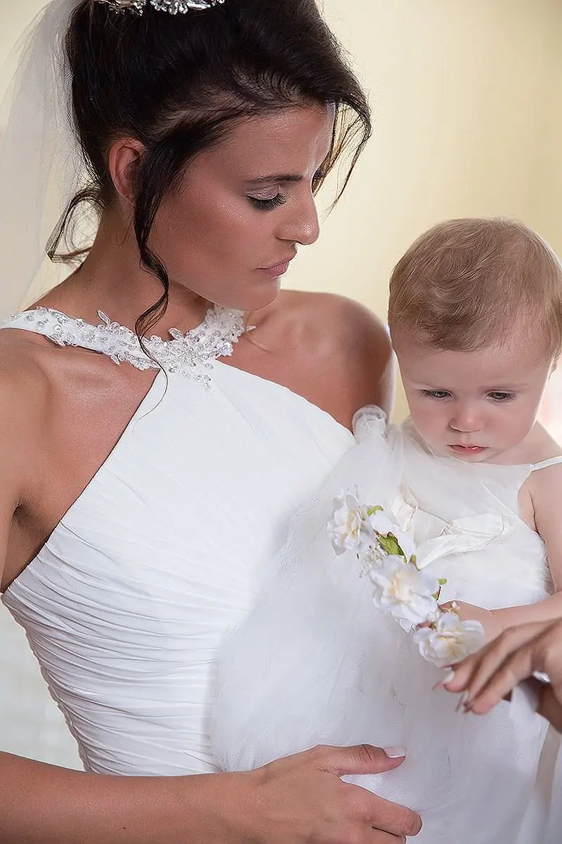 Tender mother and child baptism portrait in Mykonos, Greece