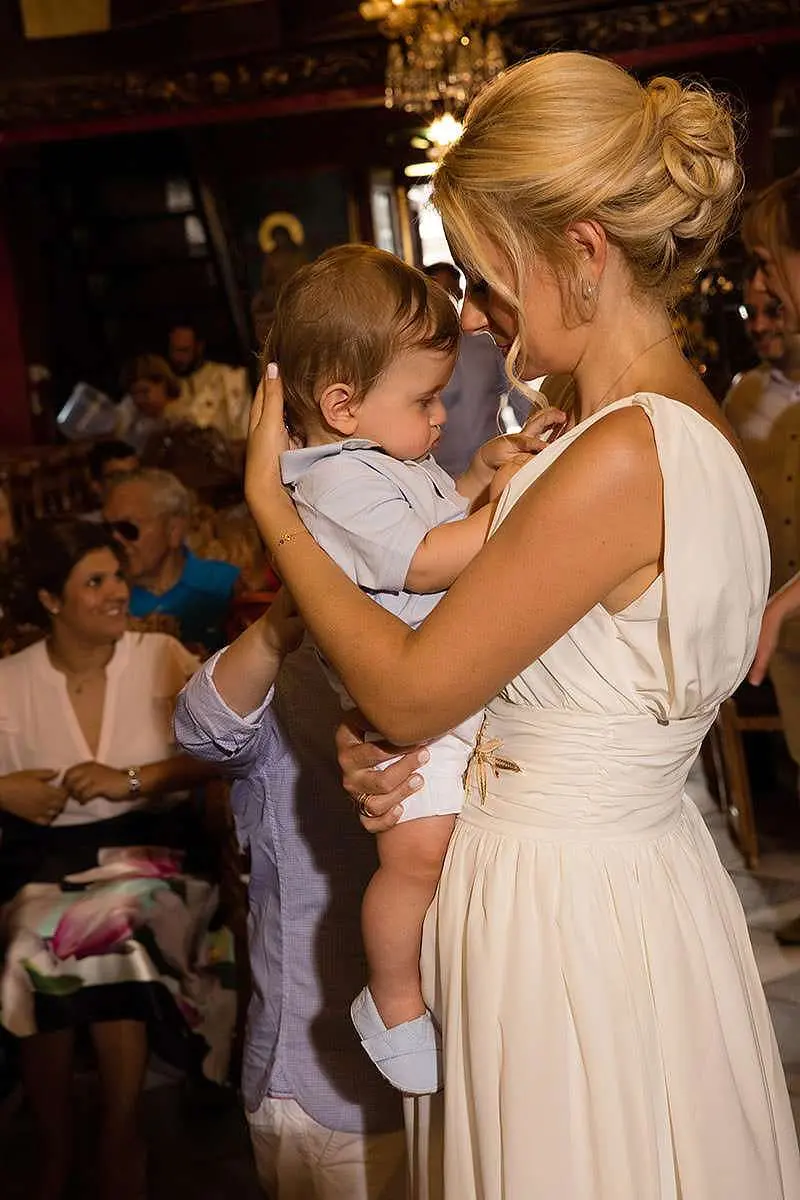 Quiet family baptism portrait at home in Mykonos, Greece