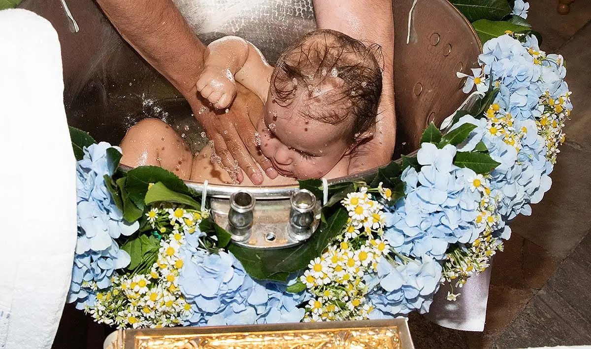 Baptismal font detail with floral wreath in Mykonos, Greece