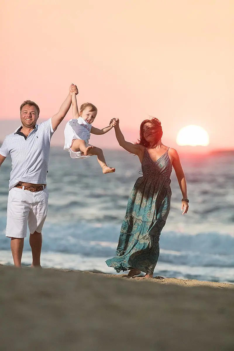 Sunset beach family lift portrait in Mykonos, Greece