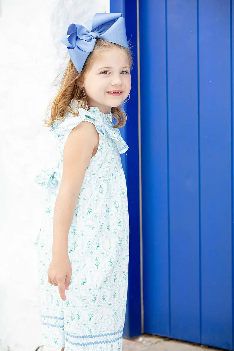 Family children portrait against whitewashed Mykonos walls in Greece