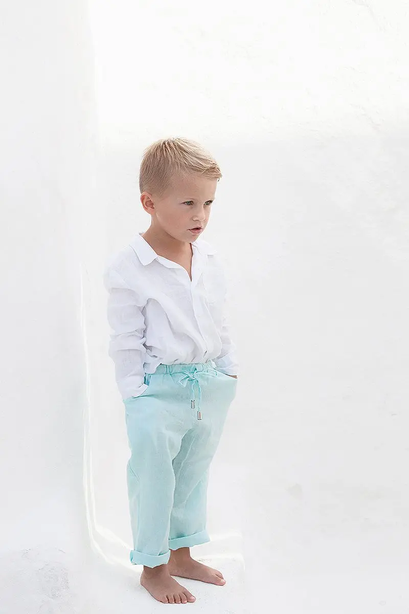 Minimal white-wall children portrait in Mykonos, Greece