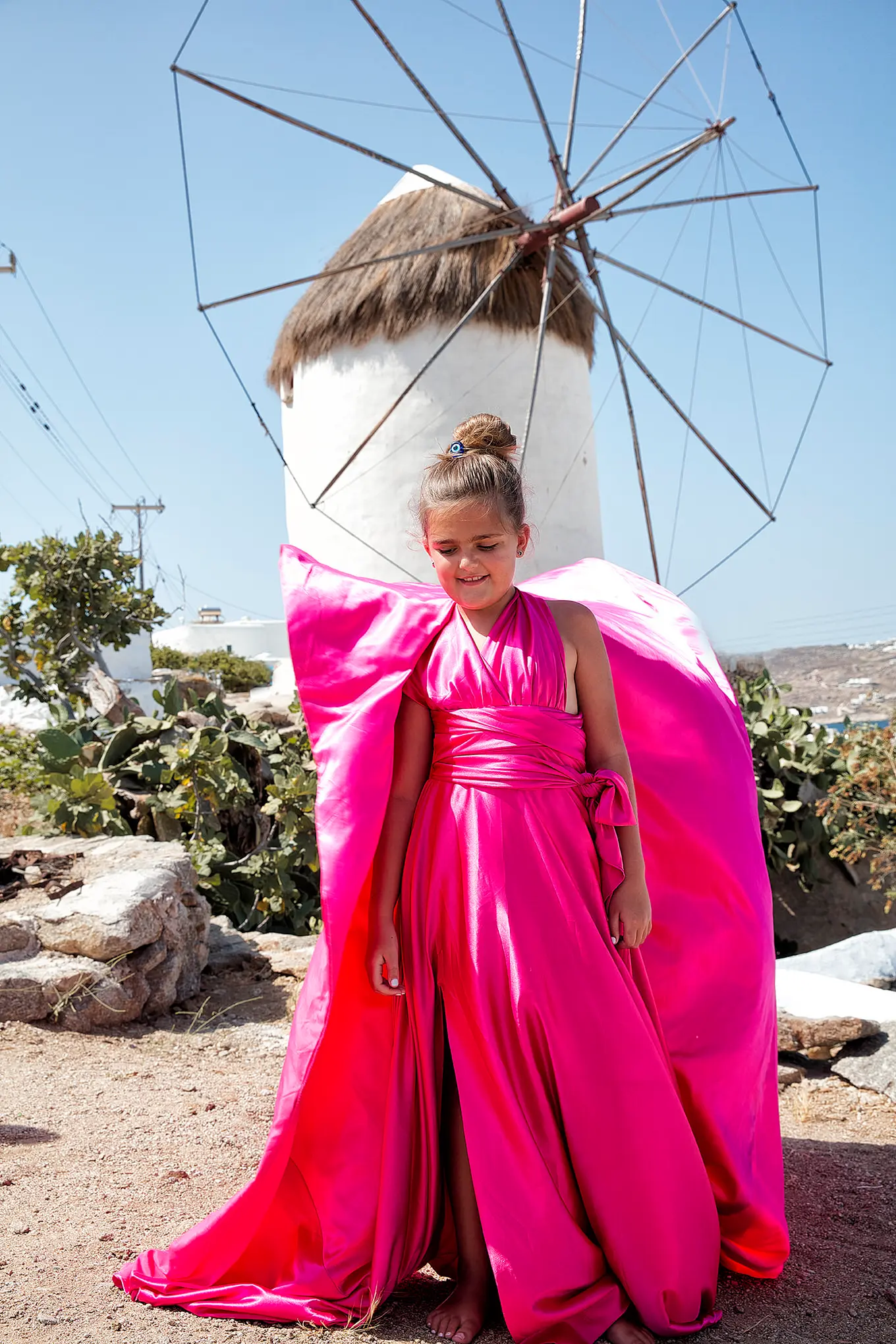 Playful family children portrait in a Mykonos alley, Greece
