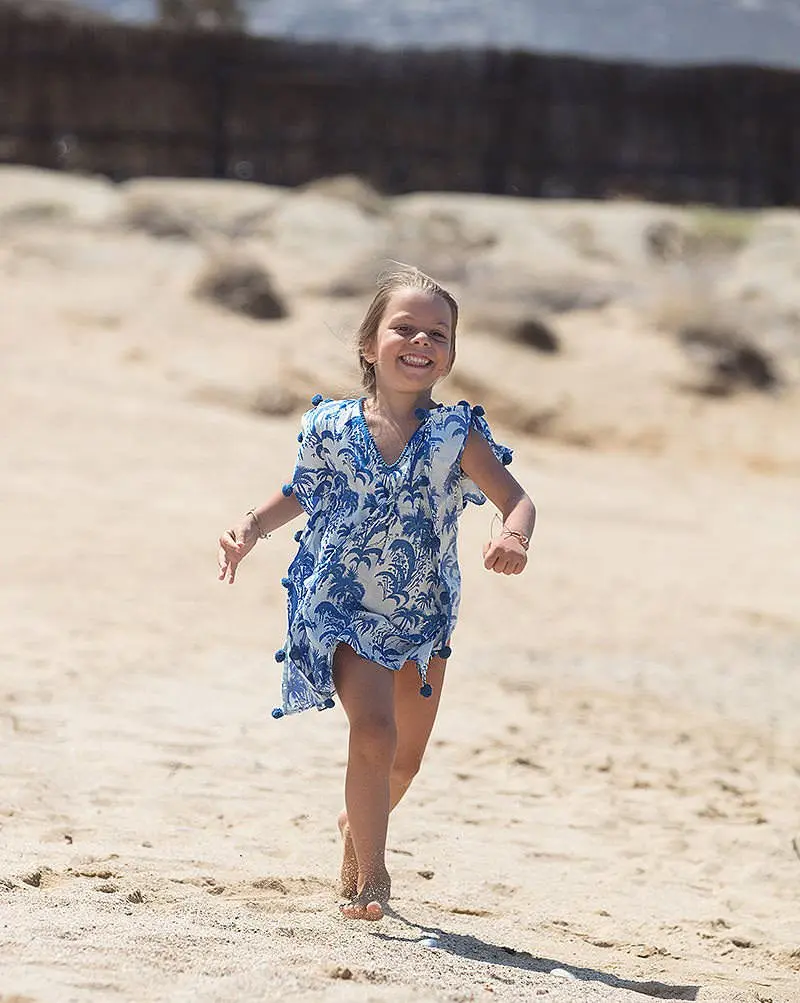 Beach run children portrait in Mykonos, Greece