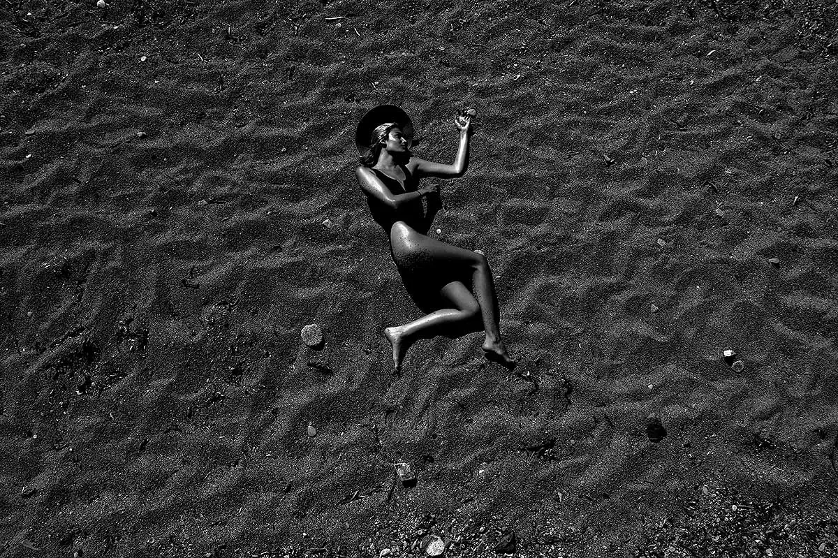 Black and white aerial drone portrait on sand in Mykonos, Greece