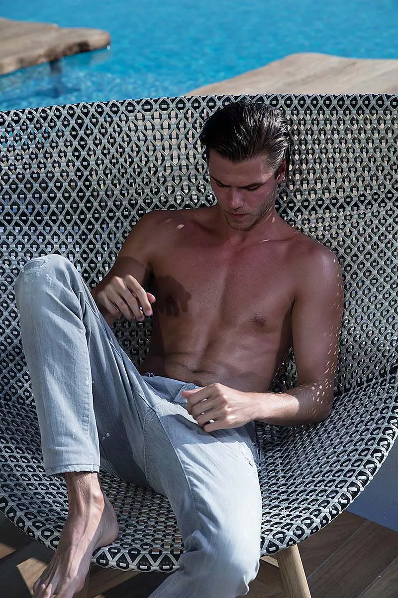 Casual luxe menswear poolside fashion editorial in Mykonos, Greece