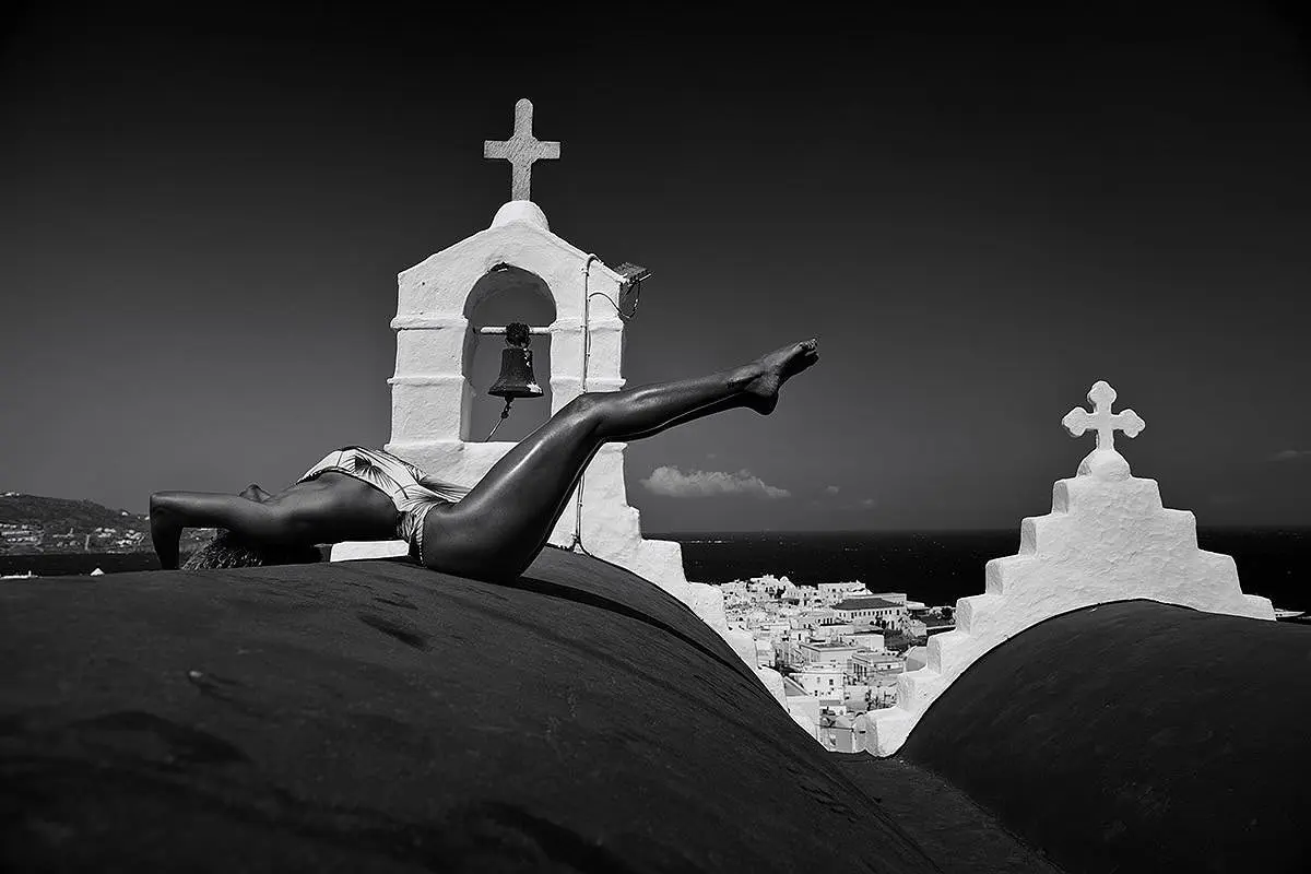 Rooftop pose menswear fashion editorial in Mykonos, Greece
