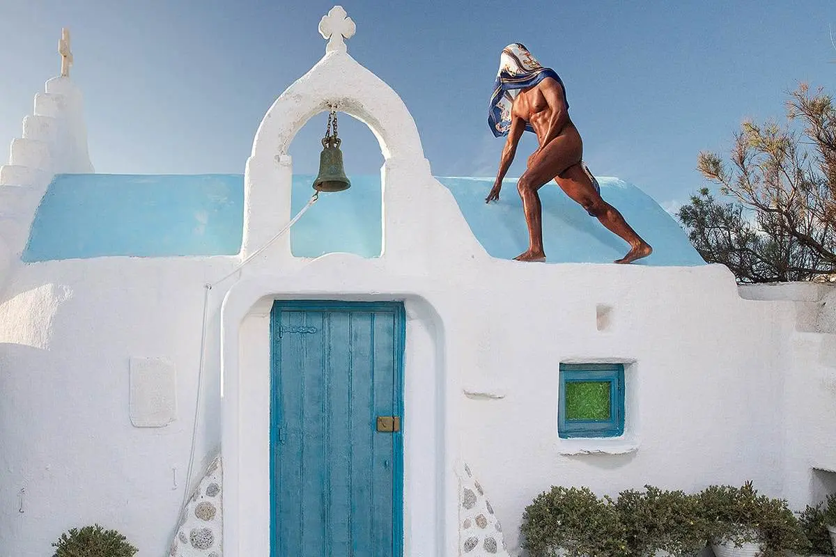 Skyline view menswear fashion editorial in Mykonos, Greece