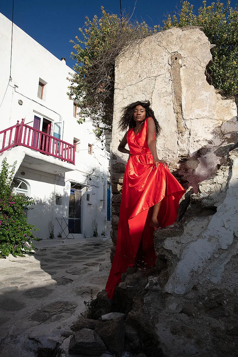 Sunlit cobalt flying dress on a sunlit terrace, photography in Mykonos, Greece