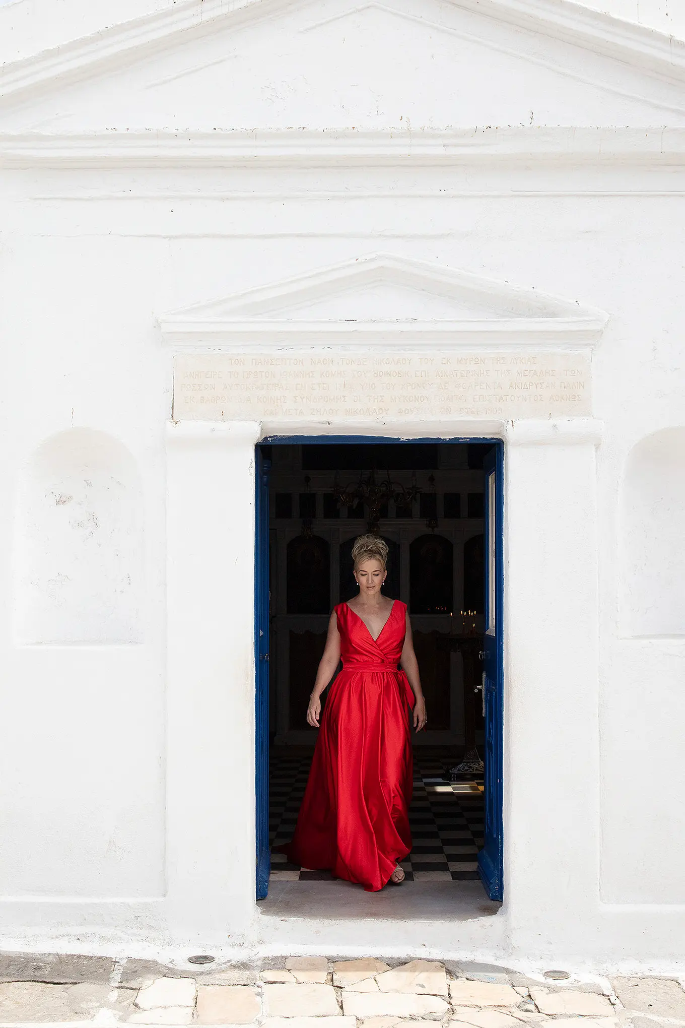 Sunlit pearl flying dress by Cycladic walls, photography in Mykonos, Greece
