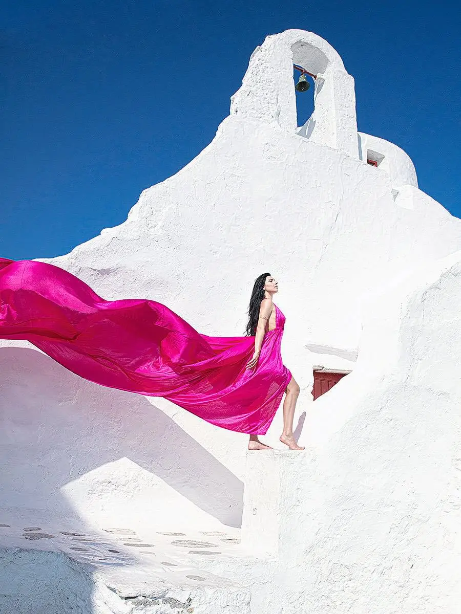 Sunlit pearl flying dress on a sunlit terrace, photography in Mykonos, Greece