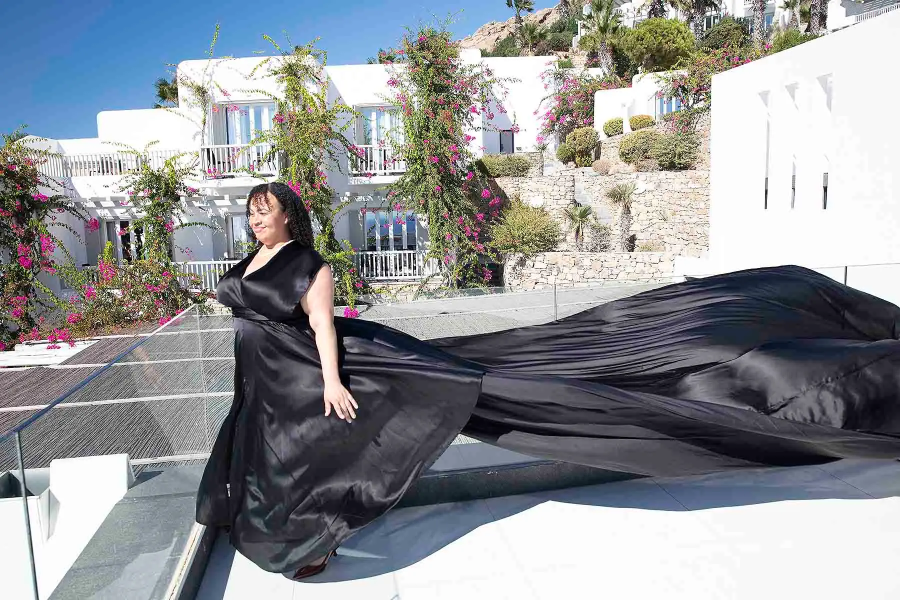 Sunlit rooftop flying dress on a sunlit terrace, photography in Mykonos, Greece
