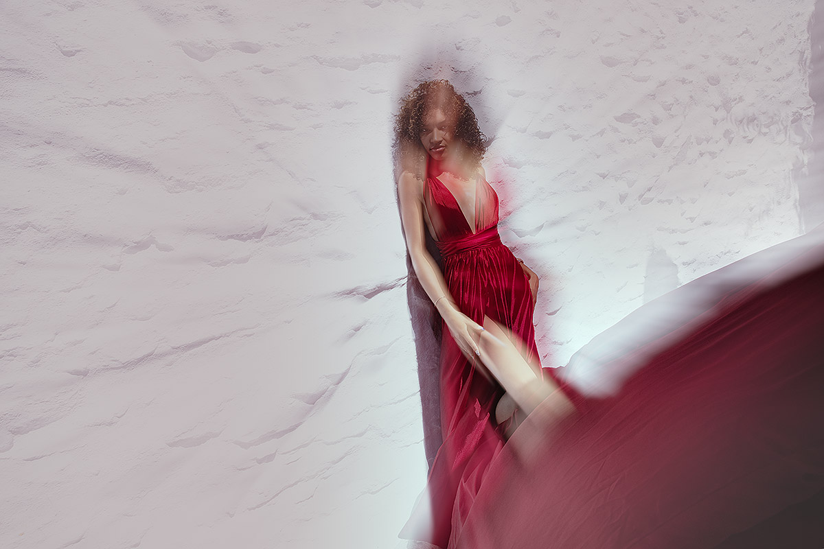 Sunlit sunset flying dress by the Aegean sea, photography in Mykonos, Greece
