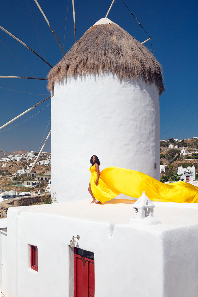 Sunlit twilight flying dress on a sunlit terrace, photography in Mykonos, Greece