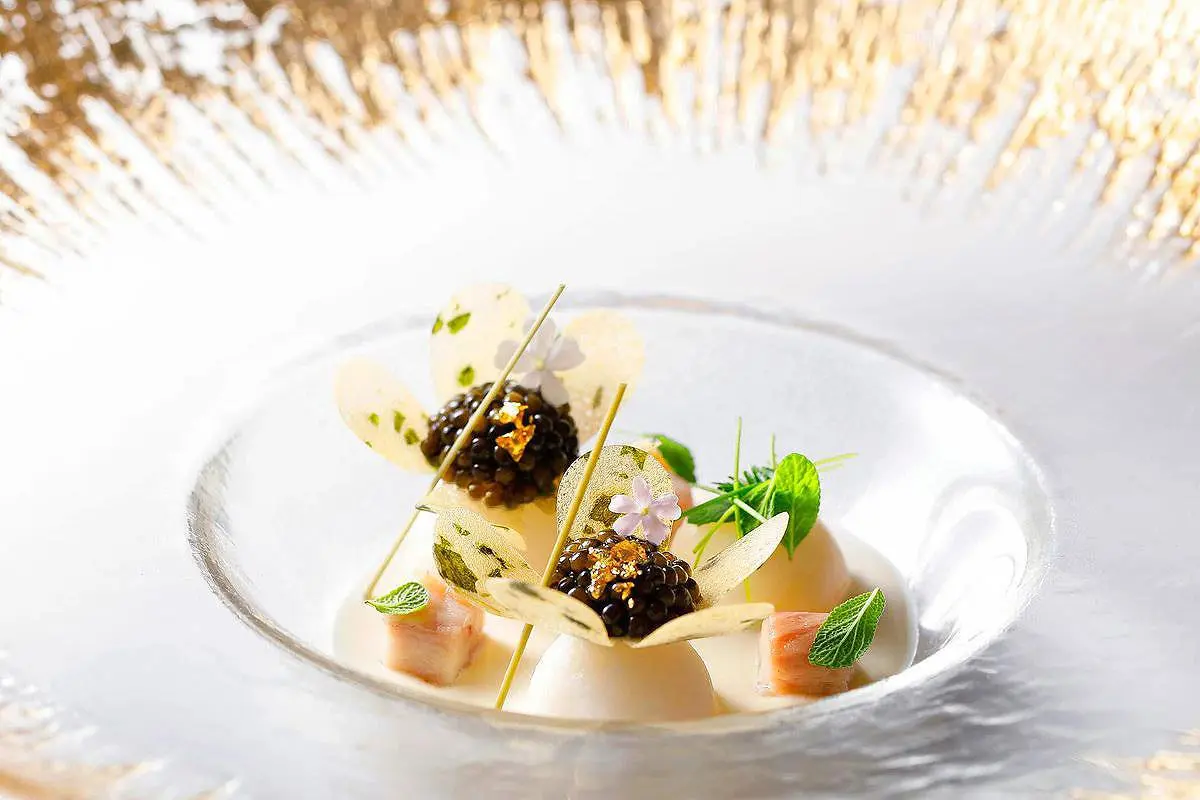 Grilled octopus on mustard puree on slate, gourmet food photography in Mykonos, Greece