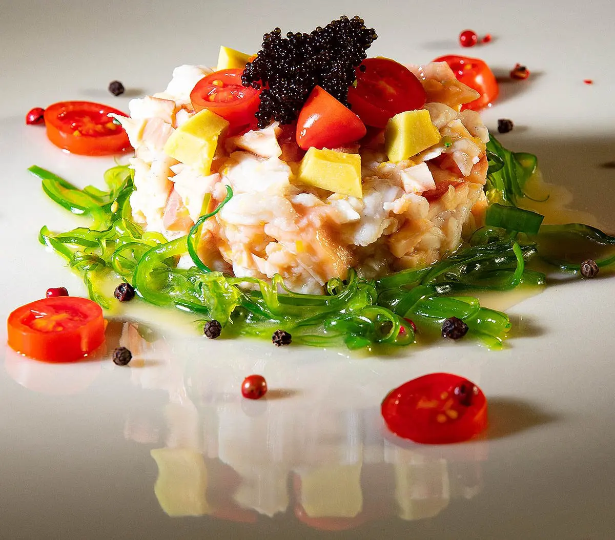 Vibrant fish tartare with caviar and tomato, food photography in Mykonos, Greece