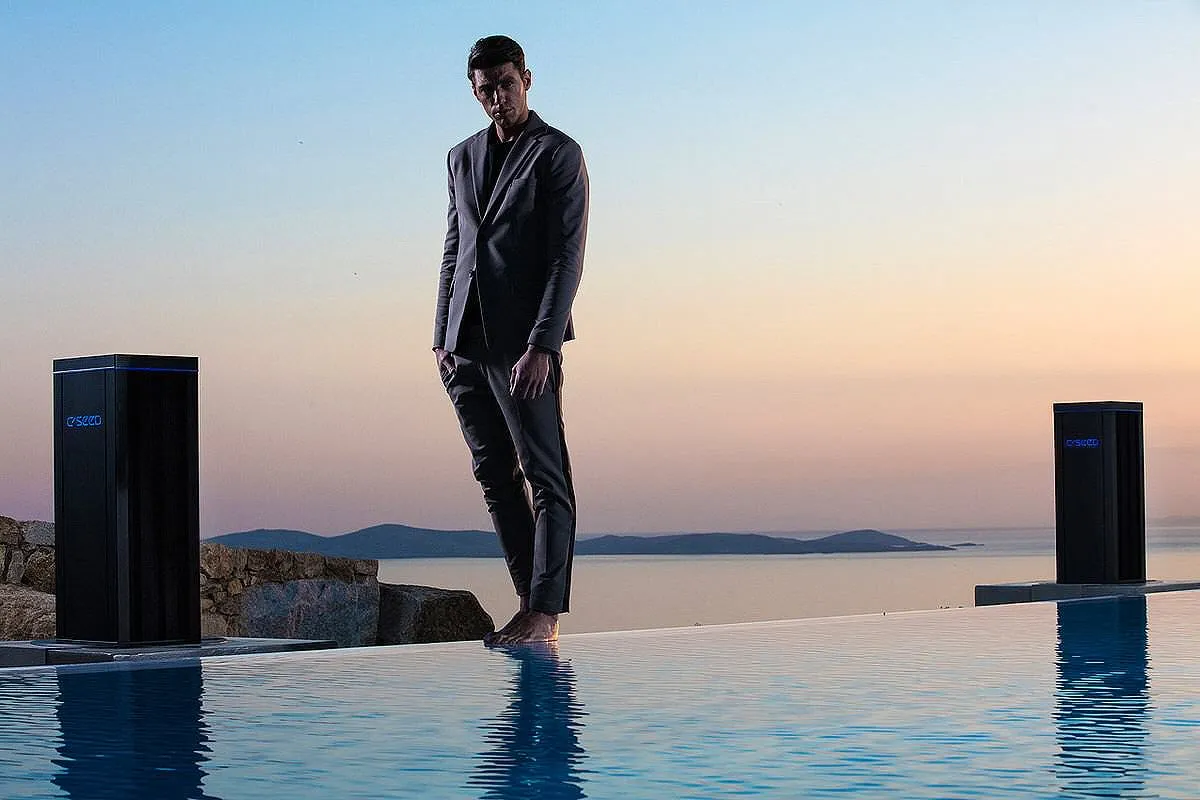 Sunlit beachfront hotels villas advertising view in Mykonos, Greece