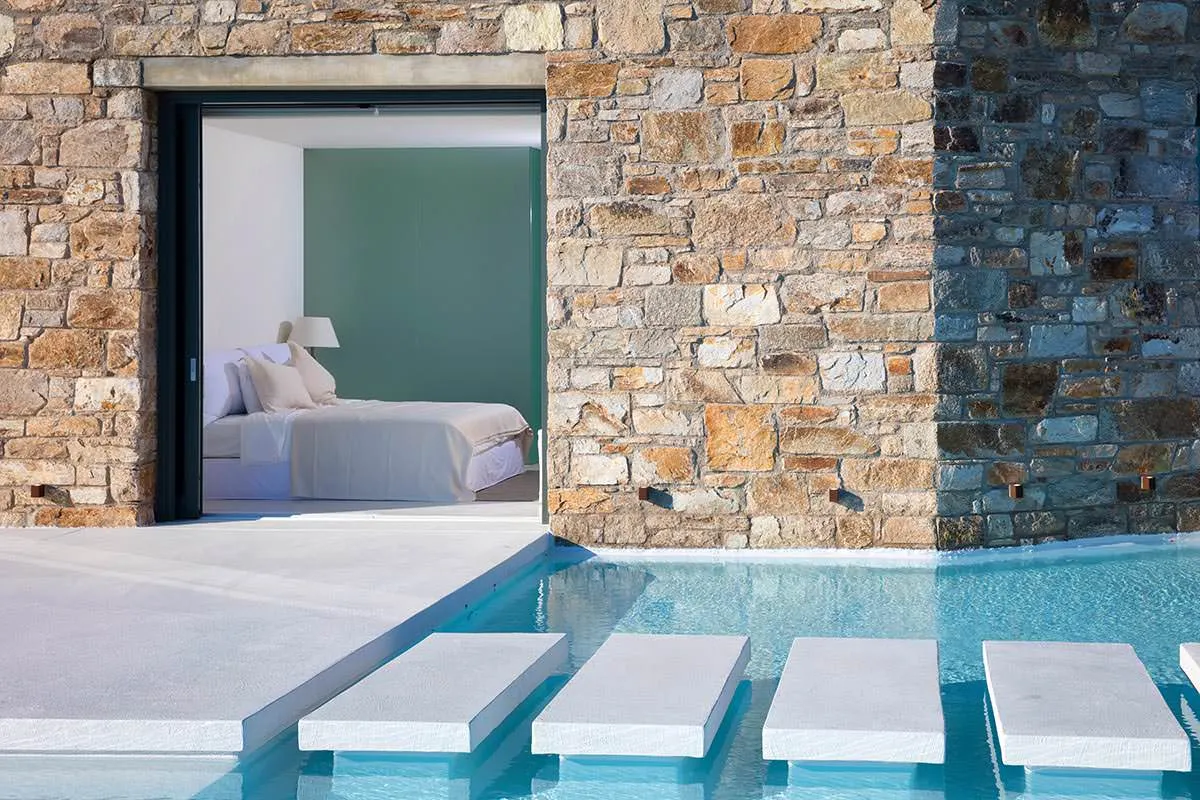 Sunlit beachfront hotels villas advertising shot in Mykonos, Greece