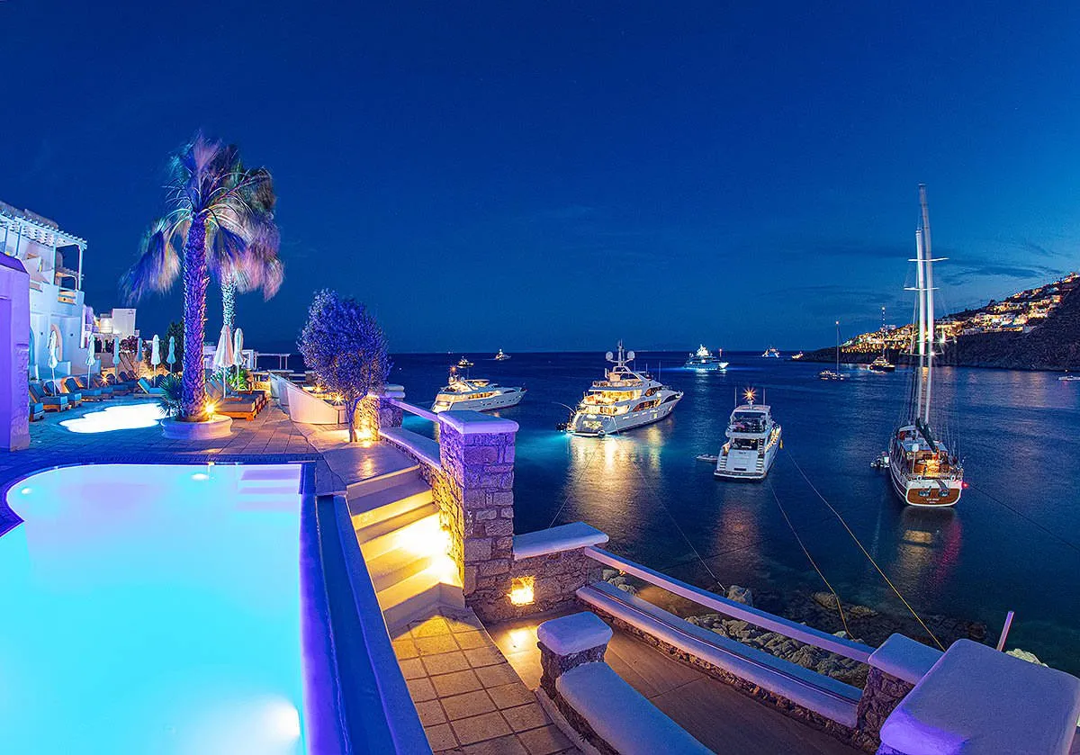 Sunlit lounge area hotels villas advertising moment in Mykonos, Greece
