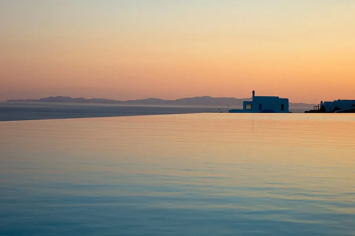 Sunlit lounge area hotels villas advertising composition in Mykonos, Greece
