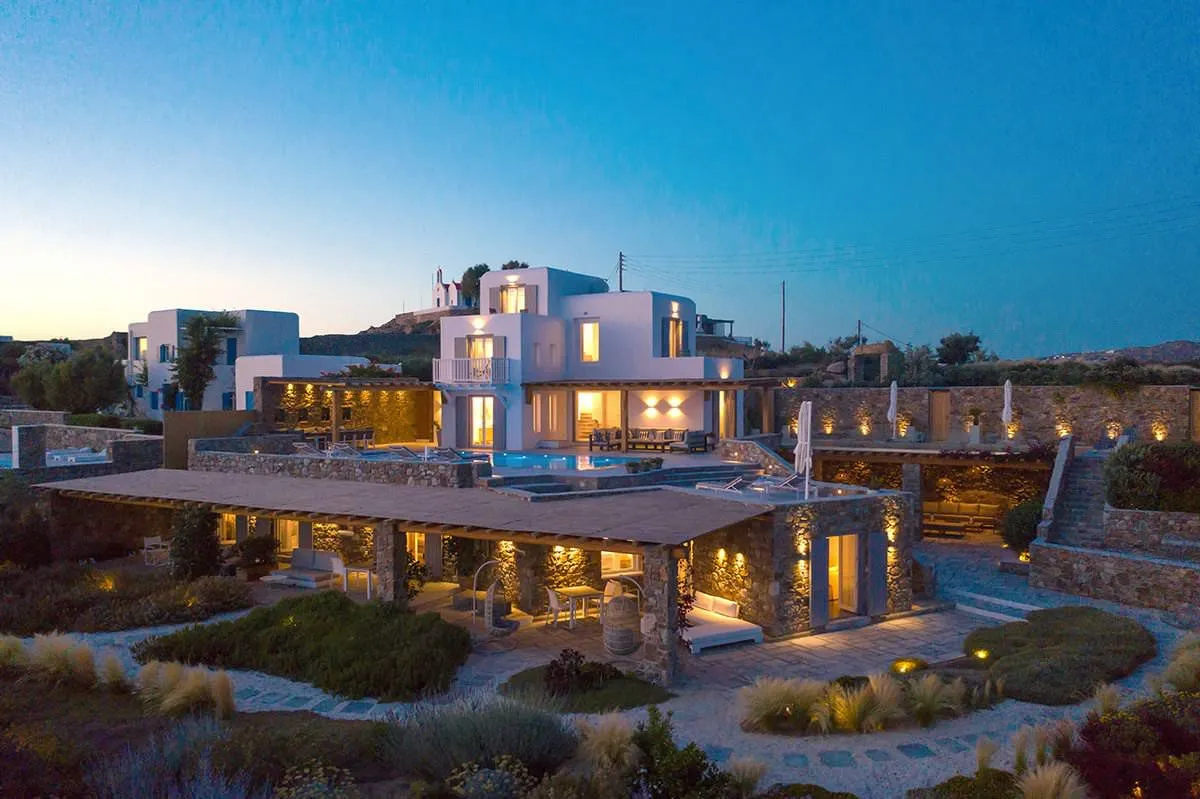 Sunlit open plan hotels villas advertising view in Mykonos, Greece