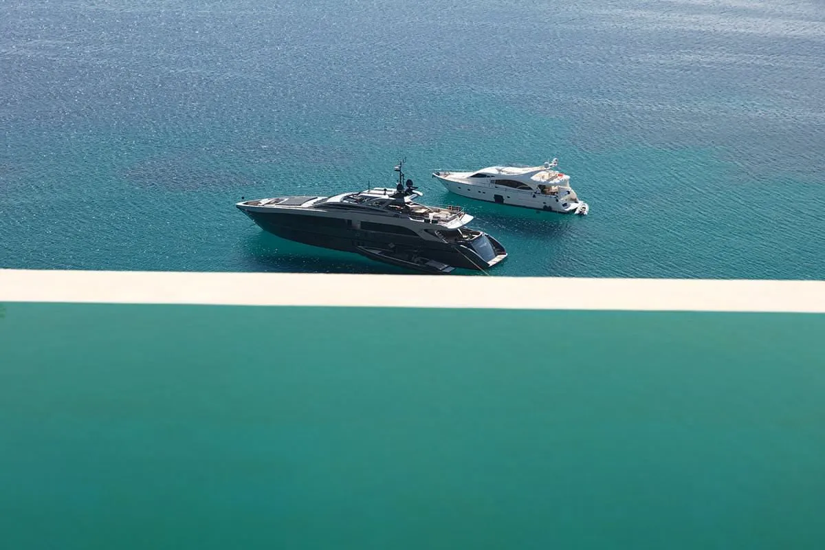 Sunlit private pool hotels villas advertising frame in Mykonos, Greece