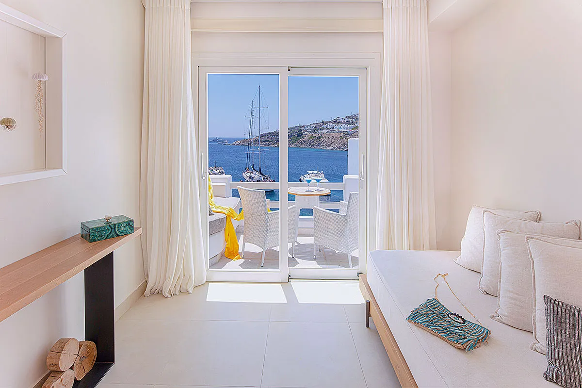 Sunlit stone lobby hotels villas advertising shot in Mykonos, Greece
