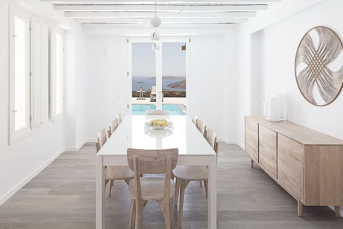 Sunlit sunset deck hotels villas advertising frame in Mykonos, Greece