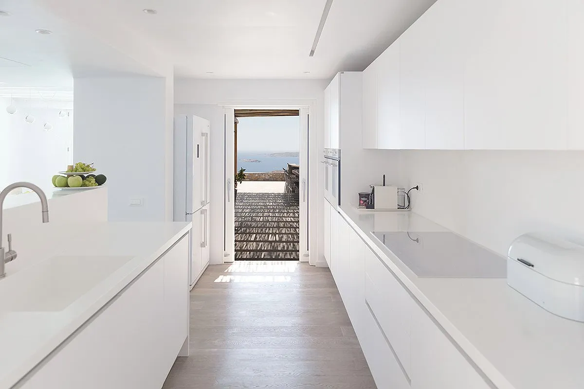 Sunlit sunset deck hotels villas advertising view in Mykonos, Greece