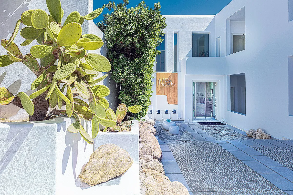 Sunlit yacht view hotels villas advertising view in Mykonos, Greece