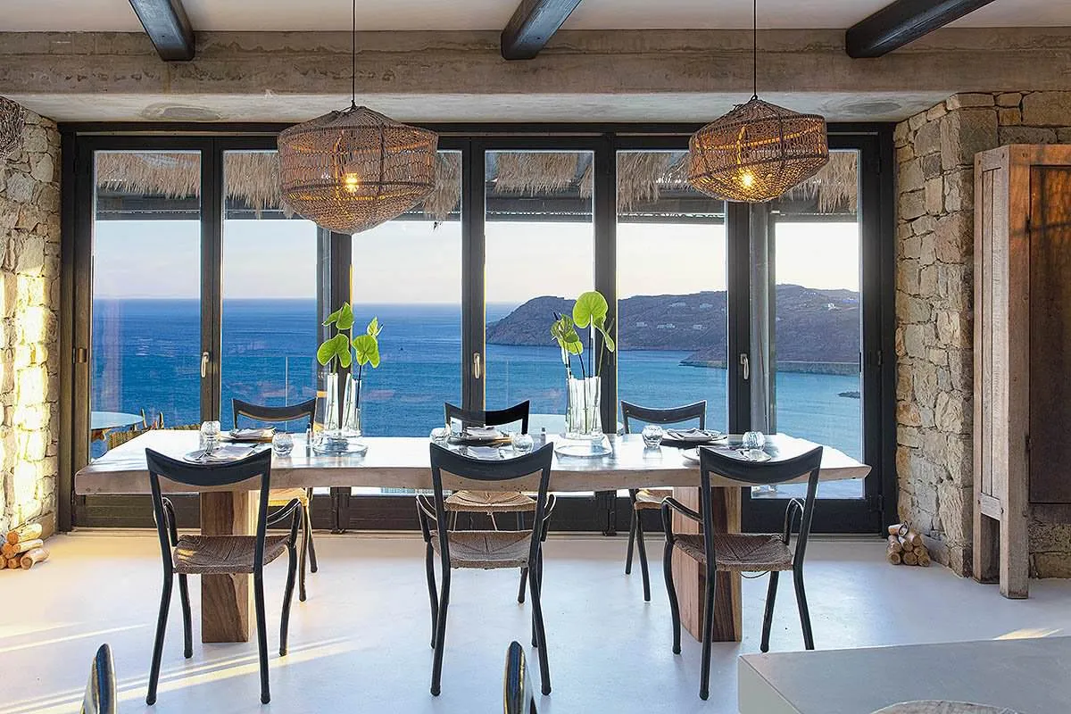 Sunlit yacht view hotels villas advertising moment in Mykonos, Greece