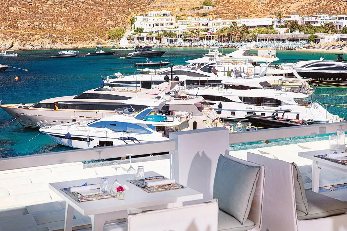 Sunlit yacht view hotels villas advertising shot in Mykonos, Greece