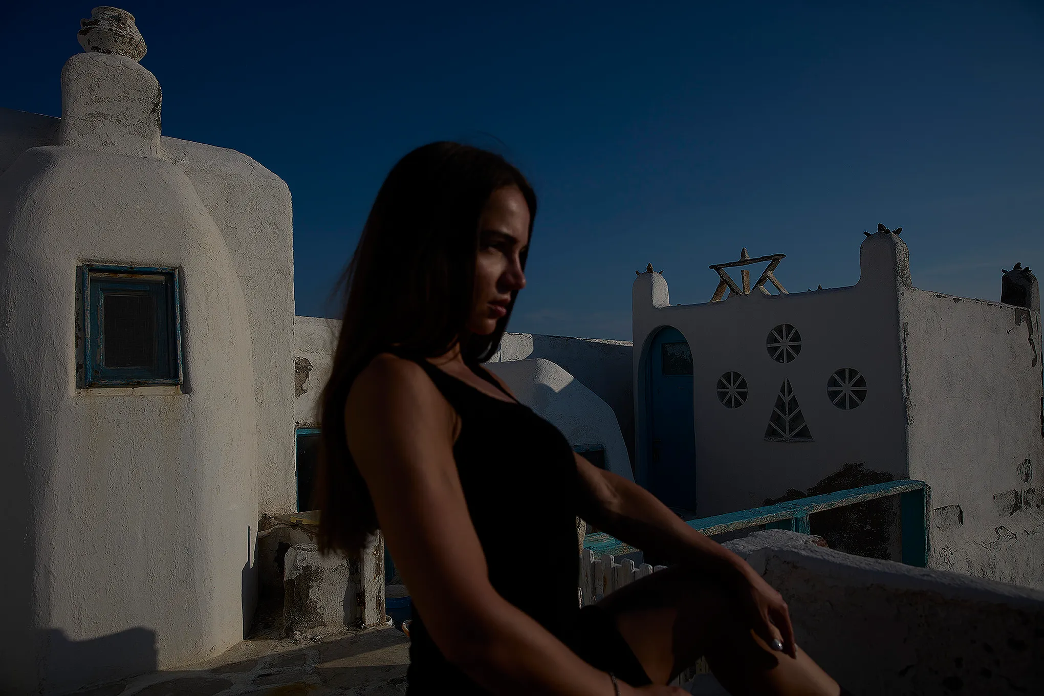 Soft-light bikini boat portrait outtake in Mykonos, Greece