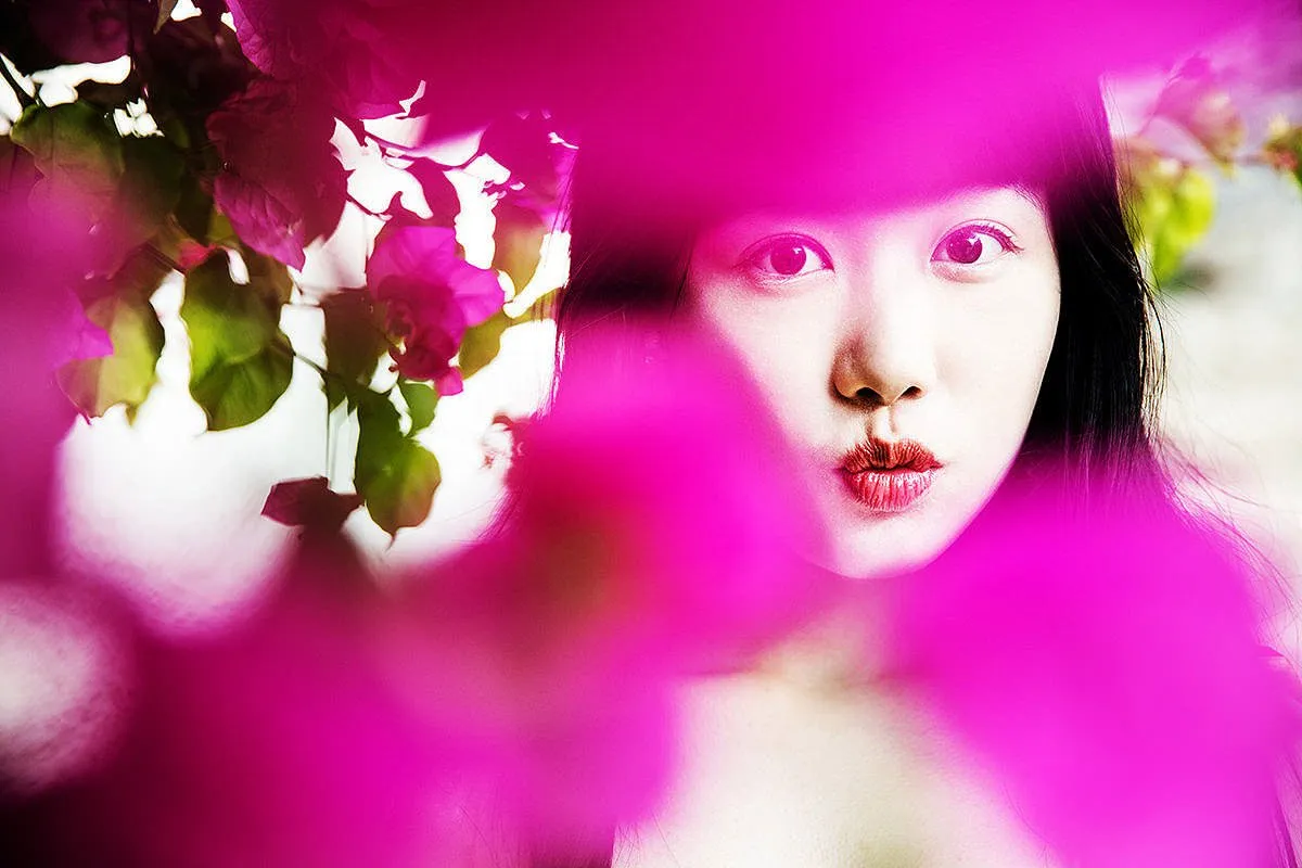 Soft-light bougainvillea Asian beauty portrait frame in Mykonos, Greece