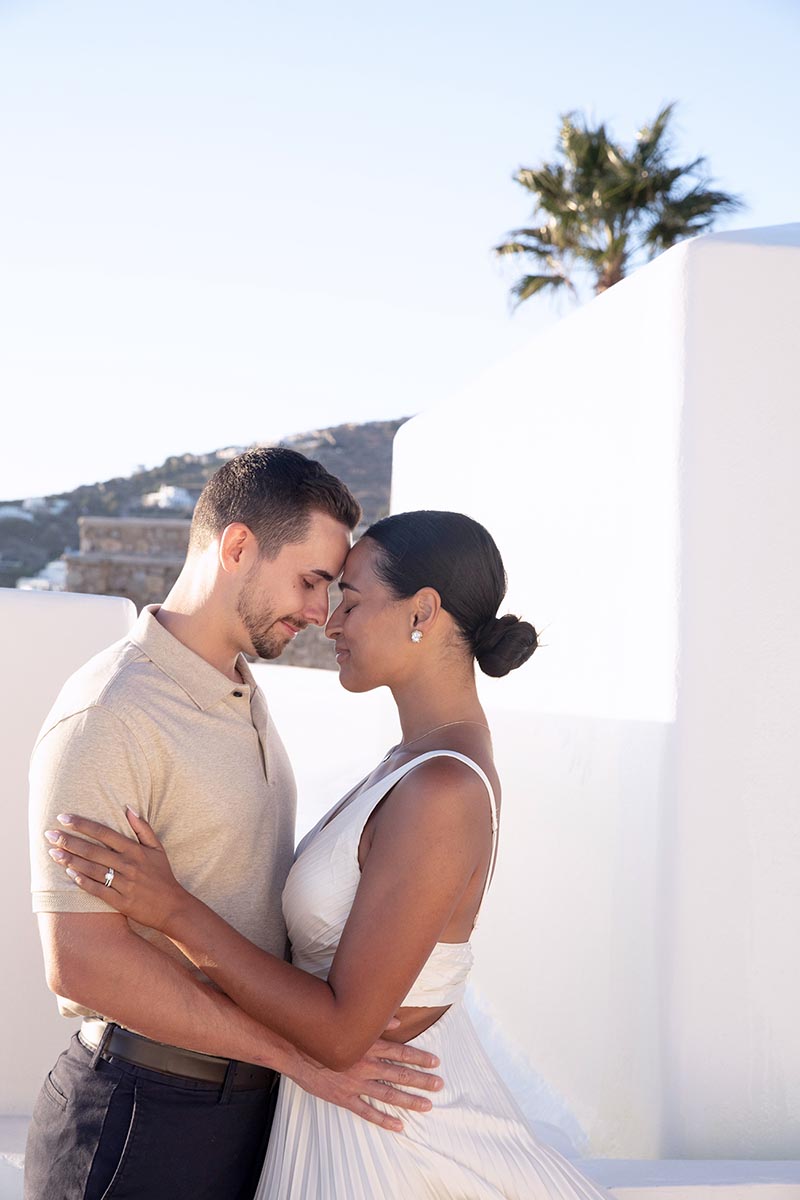 Soft-light engagement rooftop portrait frame in Mykonos, Greece
