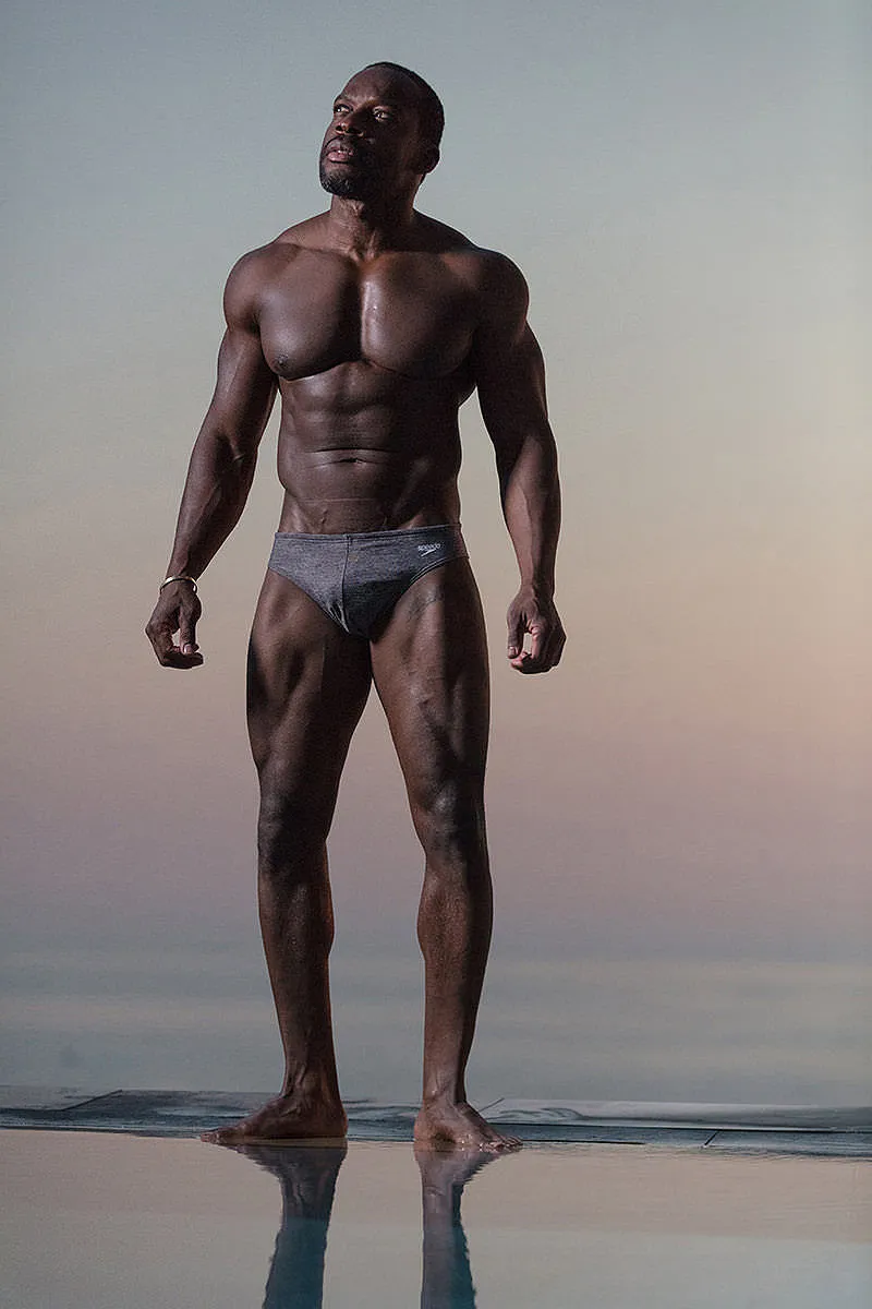 Soft-light athletic male pool portrait view in Mykonos, Greece