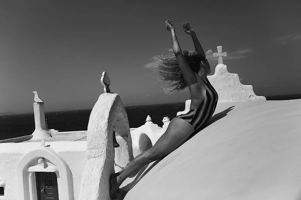 Soft-light athletic male pool portrait study in Mykonos, Greece
