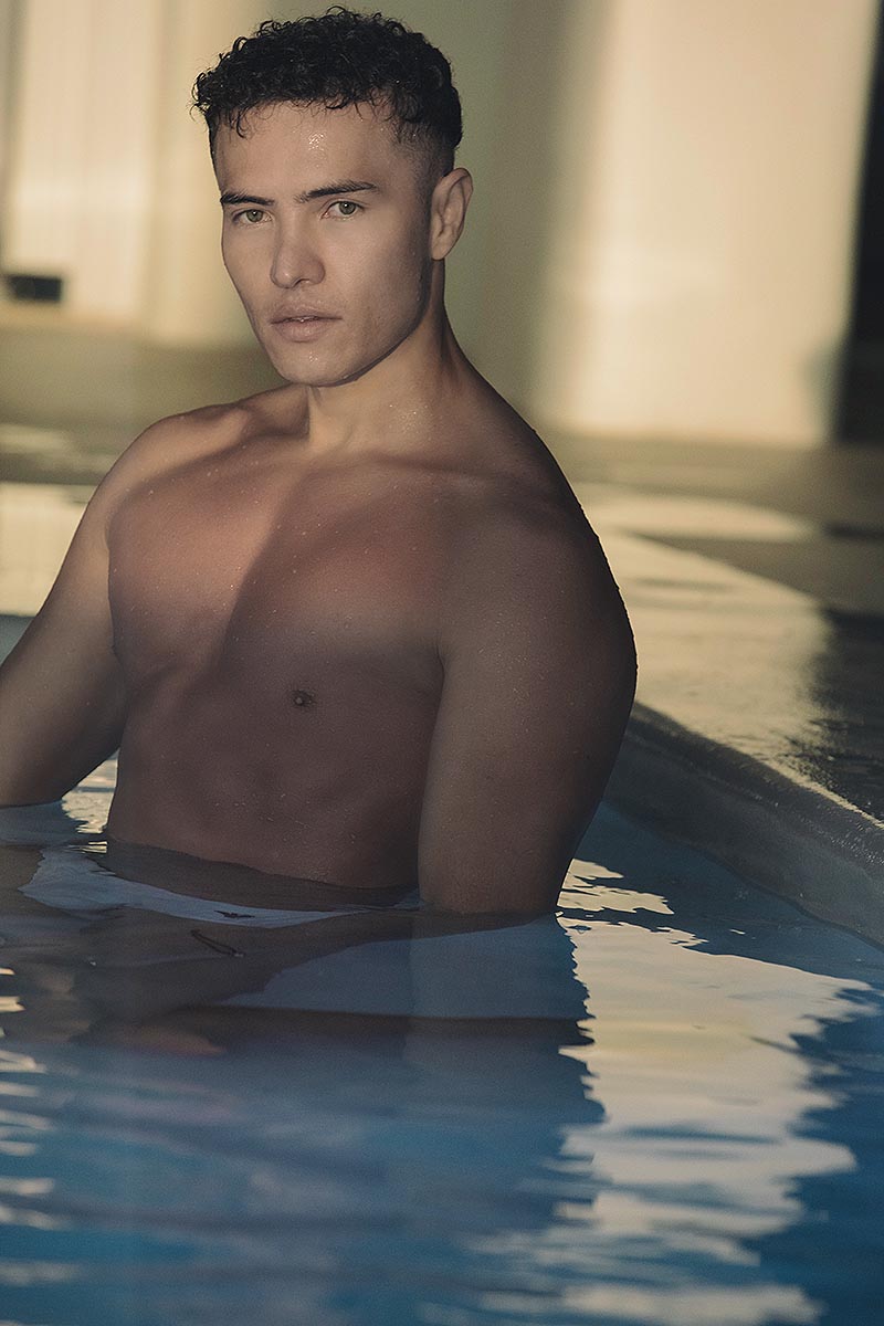 Soft-light male poolside portrait shot in Mykonos, Greece