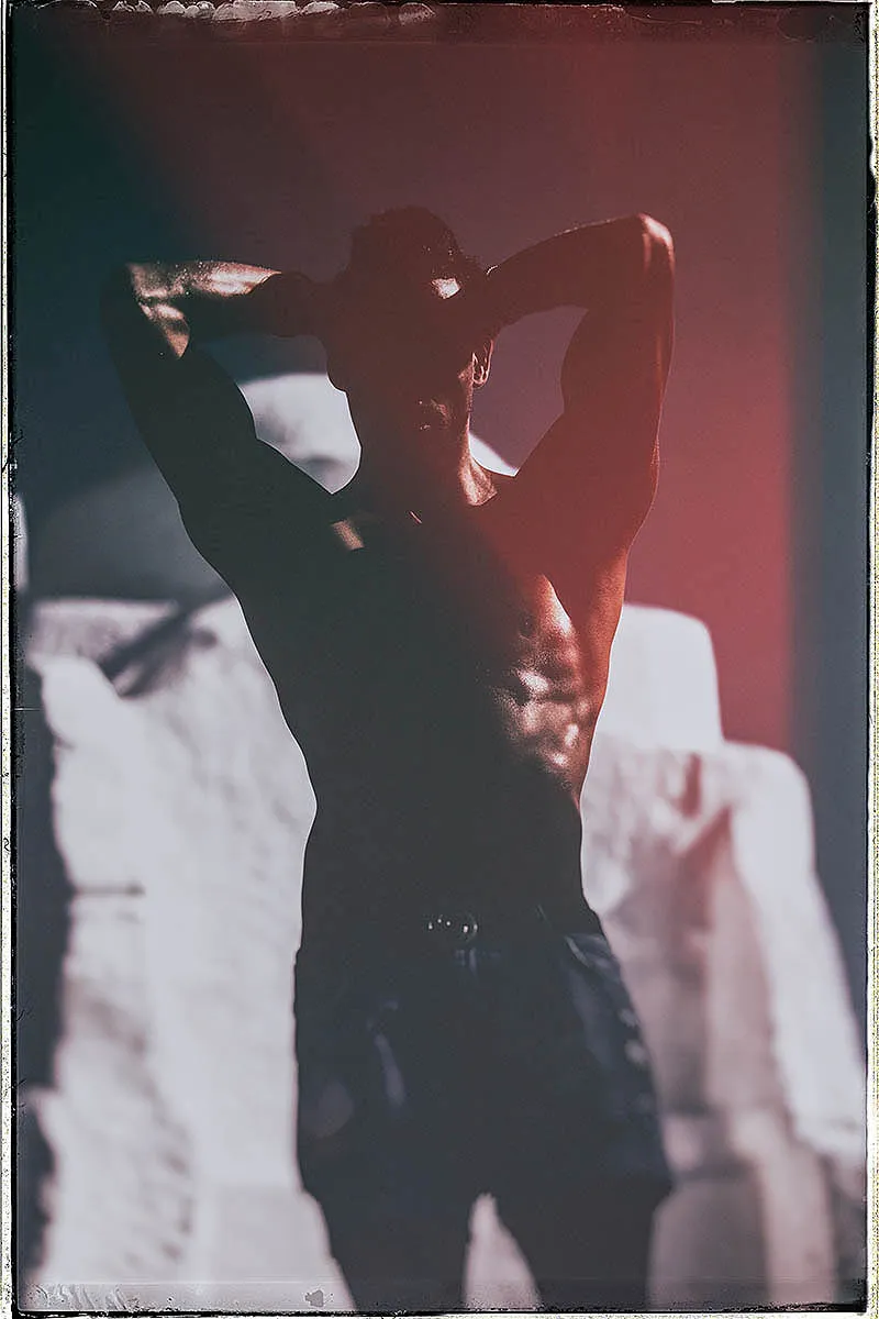 Soft-light moody silhouette male portrait frame in Mykonos, Greece