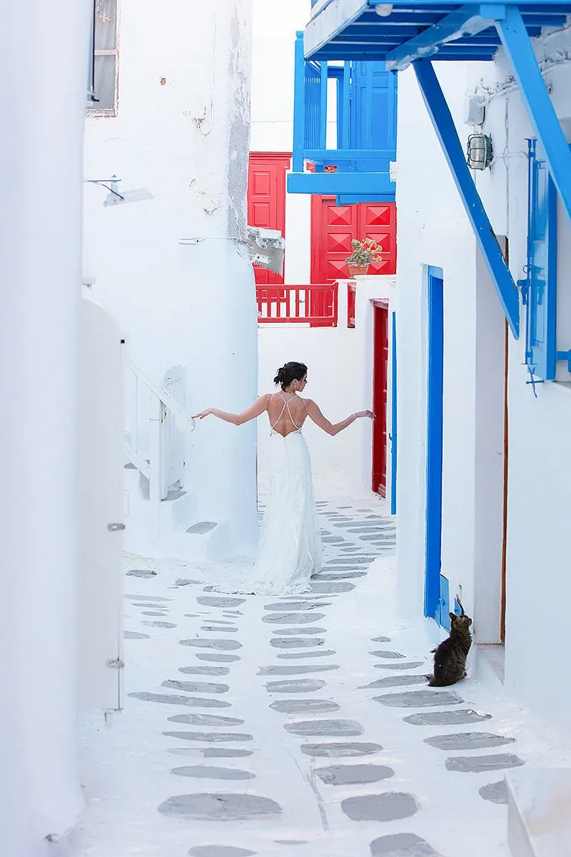 Soft-light red dress poolside portrait outtake in Mykonos, Greece