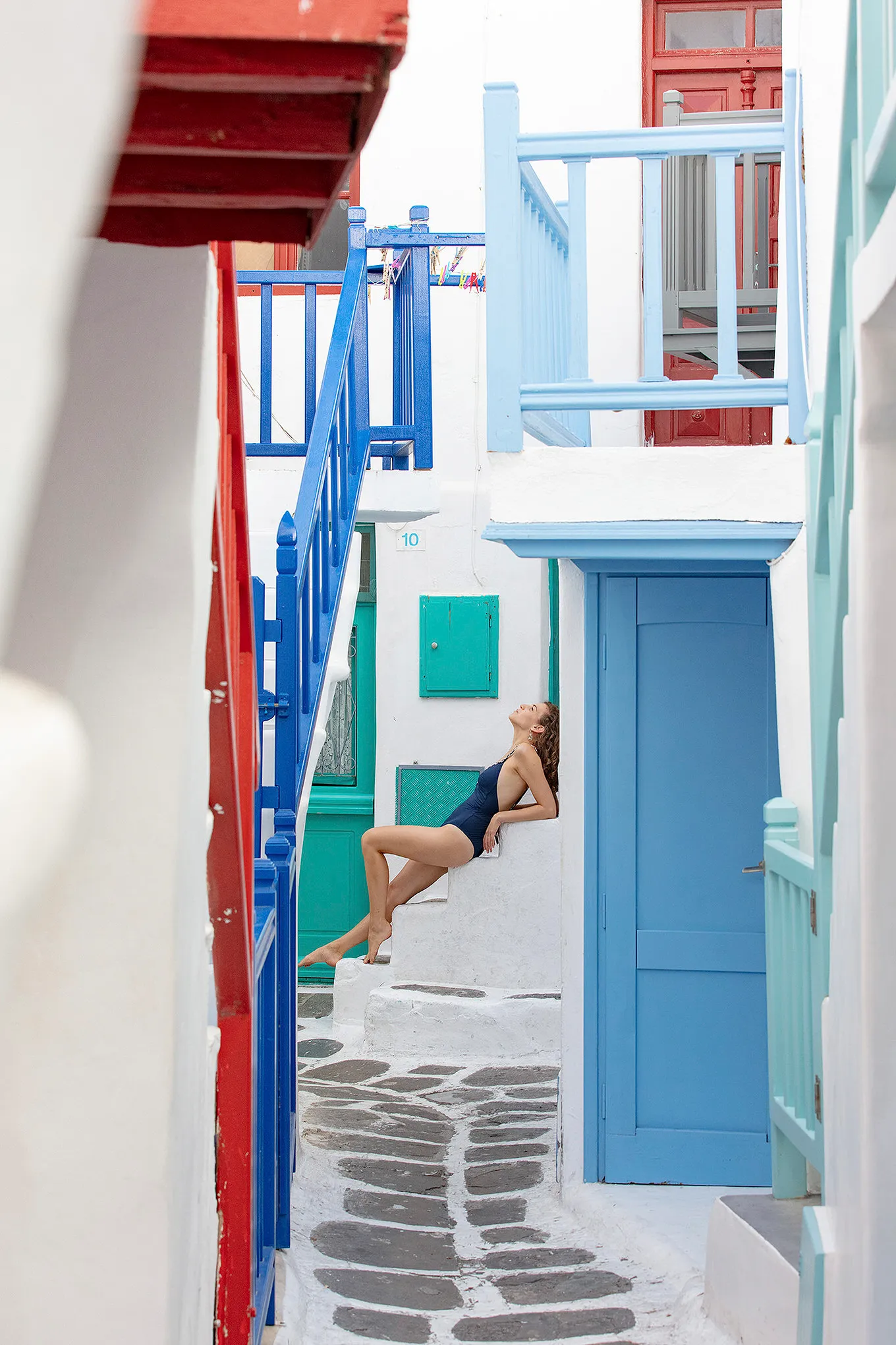 Soft-light schoolgirl editorial portrait study in Mykonos, Greece