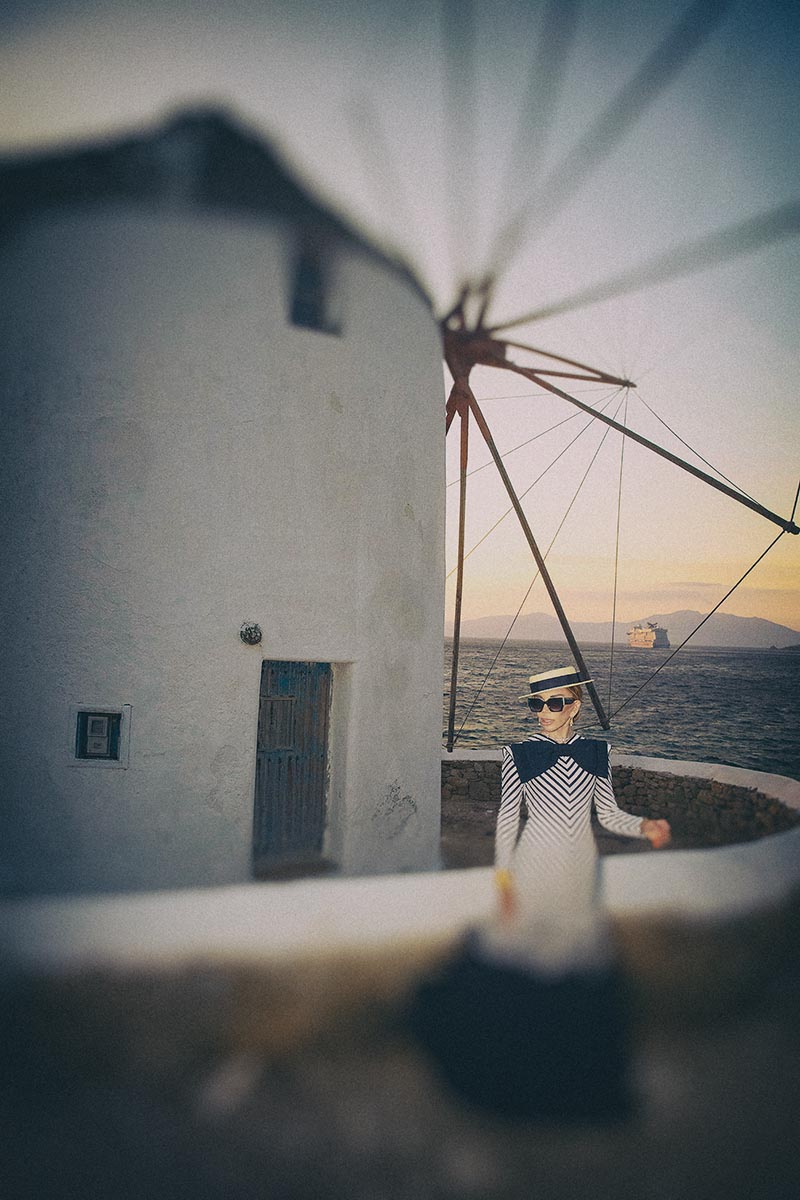 Soft-light windmill sunset portrait frame in Mykonos, Greece