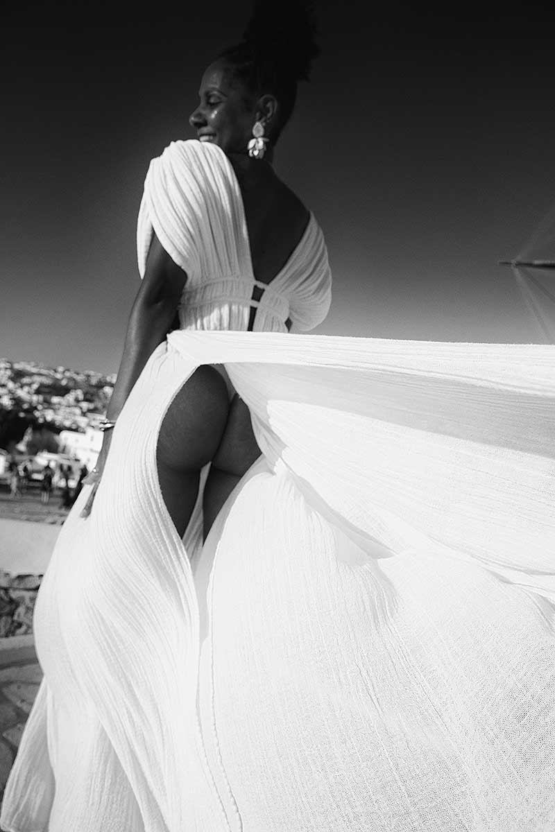 Soft-light windmill sunset portrait composition in Mykonos, Greece